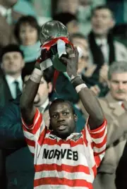 Martin Offiah of Wigan Warriors holds aloft the Regal Trophy after- Old Photo