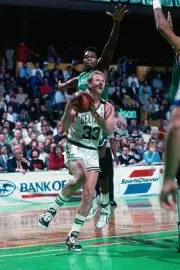 Larry Bird Boston Celtics drives to the basket v Sam Perkins Dalla- Old Photo