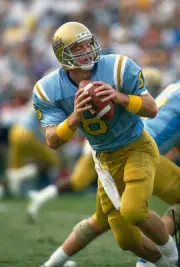 Troy Aikman UCLA Bruins drops back to pass v USC Trojans dur- Football Photo 4