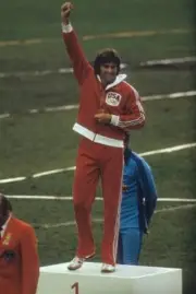 Olympics USA Bruce Jenner victorious on medal stand after winning - Old Photo