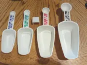 Sunbeam Nested Measuring Cup Scoop Combo Set Of Four With Keeper New Old STK OOB