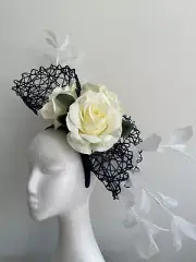 Navy basketweave fascinator with flower and feathers on a headband!