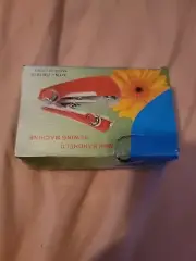 Red mini sewing portable machine