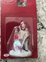 Father w/child shoveling st Nicholas square accessory