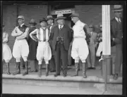 Jockey Mr McCarten and racehorse trainer Mr Price standing with ot- Old Photo