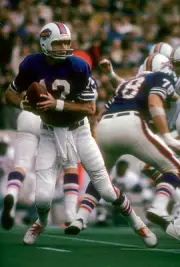 Joe Ferguson Buffalo Bills drops back to pass v the Miami Dolphin- 1974 Photo 1