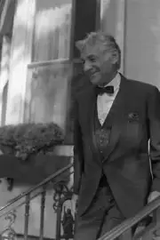 Leonard Bernstein leaving a party thrown by Jackie Onassis on the - Old Photo