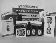 Promotional items including World Cup Ale bottles, bar towels and b - Old Photo