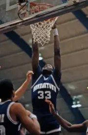 Center Patrick Ewing of the Georgetown University Hoyas reaches - 1984 Old Photo