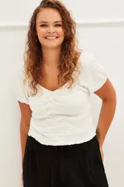 White Textured Peplum Top