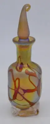 Gold Luster Perfume Bottle With Red Threading Design. Saul Alcaraz