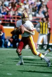 Quarterback Joe Theismann Washington Redskins drops back to pass - 1976 Photo