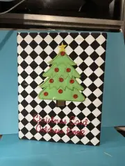 Christmas card address book with black-and-white diamond pattern and a C-tree