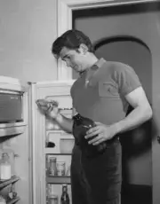 American Actor Michael Landon Helps Himself To Pie And A Drink From Old Photo