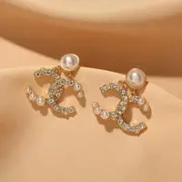 在飛比找momo購物網優惠-【Emi 艾迷】獨特珍珠鋯石雙C字 925銀針耳環
